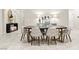 Stylish dining room with a modern table and chairs, illuminated by elegant lighting at 7502 Lush Oasis Ave, Las Vegas, NV 89113