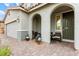 Inviting front porch area with comfortable seating and pleasant curb appeal at 7502 Lush Oasis Ave, Las Vegas, NV 89113