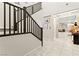 Hallway with hardwood floors leading to a stairwell and other living areas at 7502 Lush Oasis Ave, Las Vegas, NV 89113