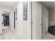 Hallway features gray carpet and multiple doors for easy access to rooms in the house at 7502 Lush Oasis Ave, Las Vegas, NV 89113