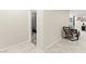 Hallway with tile floors leading to rooms and a glimpse of a bedroom at 7502 Lush Oasis Ave, Las Vegas, NV 89113
