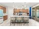 Beautiful kitchen with stainless steel appliances, center island, and modern pendant lighting at 7502 Lush Oasis Ave, Las Vegas, NV 89113