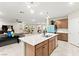 Large island and open view to the Gathering and dining rooms at 7502 Lush Oasis Ave, Las Vegas, NV 89113