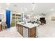 Kitchen with island and barstool seating area with a view to the living room at 7502 Lush Oasis Ave, Las Vegas, NV 89113