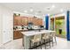 Beautiful kitchen featuring a large island with seating and stainless steel appliances at 7502 Lush Oasis Ave, Las Vegas, NV 89113