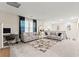 Spacious living room featuring neutral paint, contemporary sofas, and plenty of natural light at 7502 Lush Oasis Ave, Las Vegas, NV 89113