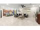 Open-concept living room with a large sectional sofa, and modern decor at 7502 Lush Oasis Ave, Las Vegas, NV 89113