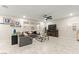 Comfortable living room with gray sofa, ceiling fan, and decorative fireplace at 7502 Lush Oasis Ave, Las Vegas, NV 89113