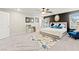Bright bedroom boasts ample space, a ceiling fan, and a tasteful accent wall for a tranquil ambiance at 7502 Lush Oasis Ave, Las Vegas, NV 89113
