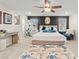 Inviting bedroom featuring a plush bed, stylish decor, and ample natural light at 7502 Lush Oasis Ave, Las Vegas, NV 89113