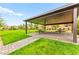 Community pavilion with shaded seating area, picnic tables and green space for outdoor gatherings at 7502 Lush Oasis Ave, Las Vegas, NV 89113
