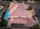 Expansive two-story home with a tile roof, inground pool, and manicured backyard at 761 Romano Ln, Henderson, NV 89012