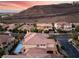 Stunning two-story home with a tile roof, inground pool, and mountain views at 761 Romano Ln, Henderson, NV 89012