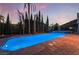 Beautiful pool with manicured landscaping, creating a serene backyard retreat with ample space at 761 Romano Ln, Henderson, NV 89012