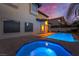 Elegant backyard featuring a tranquil spa with a view of the pool and surrounding landscape at 761 Romano Ln, Henderson, NV 89012