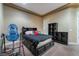 Cozy bedroom featuring a bed with storage, complemented by soft carpeting and an open shelving unit at 761 Romano Ln, Henderson, NV 89012