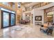 Elegant home foyer featuring high ceilings, a wrought iron staircase, and views of the dining area at 761 Romano Ln, Henderson, NV 89012