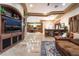 Spacious living area with custom entertainment center and bar area at 761 Romano Ln, Henderson, NV 89012