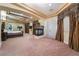 Expansive main bedroom featuring tray ceilings, a fireplace, and elegant drapery at 761 Romano Ln, Henderson, NV 89012