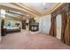 Expansive main bedroom featuring tray ceilings, a fireplace, and elegant drapery at 761 Romano Ln, Henderson, NV 89012