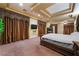 Main bedroom featuring tray ceilings, recessed lighting, and a fireplace at 761 Romano Ln, Henderson, NV 89012