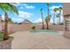 Private backyard offering a refreshing pool, mature palm trees, and a spacious patio for entertaining at 8379 Drop Camp St, Las Vegas, NV 89123