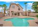 Stunning two-story home featuring a private backyard oasis with pool, mature trees, and ample patio space at 8379 Drop Camp St, Las Vegas, NV 89123