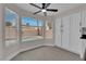Bright kitchen features granite counters, full pantry and a view of the pool through bay windows at 8379 Drop Camp St, Las Vegas, NV 89123