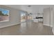 Bright living room featuring views of the pool, tile flooring and access to the kitchen at 8379 Drop Camp St, Las Vegas, NV 89123