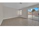Bright room featuring sliding glass door with views of the pool at 8379 Drop Camp St, Las Vegas, NV 89123