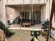 View of patio and backyard with outdoor furniture and play equipment at 8769 Country View Ave, Las Vegas, NV 89129