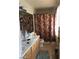 Bathroom featuring double vanity and shower with floral curtain at 8769 Country View Ave, Las Vegas, NV 89129
