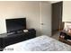 Cozy bedroom with a dresser and open doorway at 8769 Country View Ave, Las Vegas, NV 89129