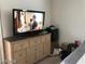 Bedroom featuring dresser and TV at 8769 Country View Ave, Las Vegas, NV 89129