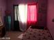 Cozy Eiffel Tower-themed bedroom with red and white curtains at 8769 Country View Ave, Las Vegas, NV 89129