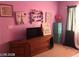 Cozy bedroom with a window, storage and wooden dresser at 8769 Country View Ave, Las Vegas, NV 89129