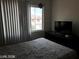 Bright bedroom with window and view of the neighborhood at 8769 Country View Ave, Las Vegas, NV 89129