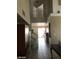 Spacious entryway featuring tile floors, high ceilings, and a view of the staircase at 8769 Country View Ave, Las Vegas, NV 89129