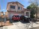 Charming two-story home with a two-car garage and covered porch area for welcoming guests at 8769 Country View Ave, Las Vegas, NV 89129