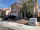 Well-maintained two-story home with front yard landscaping and an attached garage at 8769 Country View Ave, Las Vegas, NV 89129