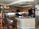 Well-equipped kitchen with granite countertops, wooden cabinets, and modern black appliances at 8769 Country View Ave, Las Vegas, NV 89129