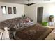 Spacious living room featuring a ceiling fan, comfortable seating, and an elegant decorative rug at 8769 Country View Ave, Las Vegas, NV 89129