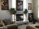 Comfortable living room area with fireplace and neutral tones, creating a relaxing atmosphere at 8769 Country View Ave, Las Vegas, NV 89129