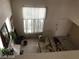 Overhead view of a living room with high ceilings, natural light, and tile entry at 8769 Country View Ave, Las Vegas, NV 89129