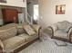 Inviting living room featuring a patterned rug and comfortable seating arrangement at 8769 Country View Ave, Las Vegas, NV 89129