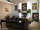 Cozy living room with a fireplace, neutral walls, and decor, perfect for gatherings at 8769 Country View Ave, Las Vegas, NV 89129