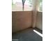 An empty private patio featuring stucco walls, ready for personalization and outdoor relaxation at 8769 Country View Ave, Las Vegas, NV 89129