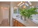 Bright bathroom featuring dual sinks, stylish fixtures, and plenty of counter space at 8800 Crescent Ridge Ln, Las Vegas, NV 89134