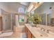 Elegant bathroom features double sinks, large mirrors, and separate shower and tub at 8800 Crescent Ridge Ln, Las Vegas, NV 89134