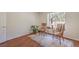 Bright bedroom with hardwood floors, large window, and seating arrangement at 8800 Crescent Ridge Ln, Las Vegas, NV 89134